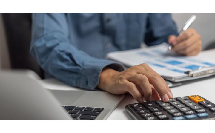 Businessman working on calculator